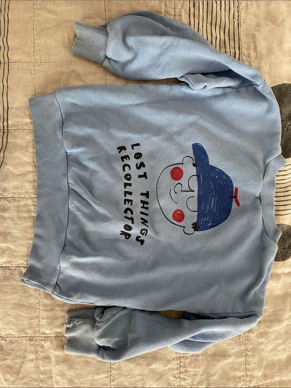 Bobo Choses Light Blue Graphic Sweatshirt with Playful Face